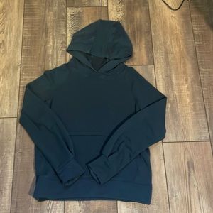 This is a used dark blue sweatshirt, it is Athleta and it is a size L in kids!